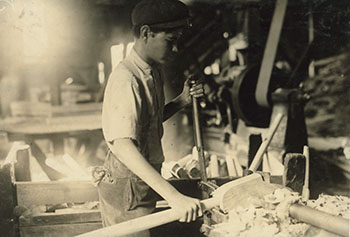 Before child labor laws were enacted, many factories employed children under dangerous conditions. This 15-year-old boy was operating a boring machine that severely injured another boy's hand. Pittman Handle Factory, Denison, TX, 1913. (Library of Congress, LC-DIG-nclc-04898)